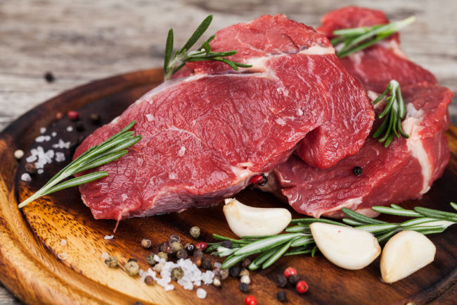 36177030 – raw beef meat on a cutting board